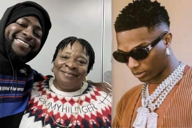 NIGERIANS REACT AS SINGER DAVIDO POSES WITH WIZKID'S MOTHER, CARRIES HER HANDBAG AT THE AIRPORT 