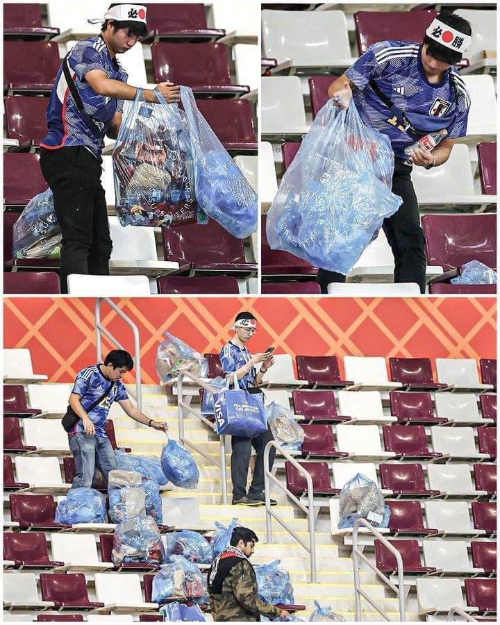 PHOTOSTORY: JAPANESE FANS CLEAN STADIUM AFTER MARCH
