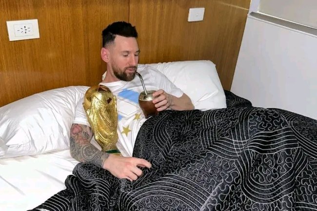 PHOTOS: MESSI IN BED WITH WORLD CUP TROPHY