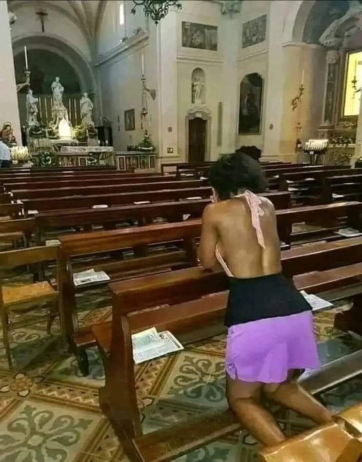 IN THE CHURCH!!! WITH THIS TYPE OF DRESS, DO YOU THINK GOD WILL ANSWER HER PRAYERS?